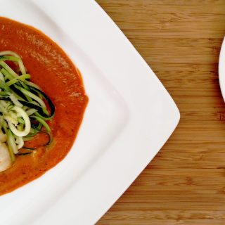 Broiled Cod with Roasted Red Pepper Coulis on white plate