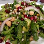 spinach salad on a white plate