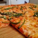 Thin Crust Pizza with cheese and basil