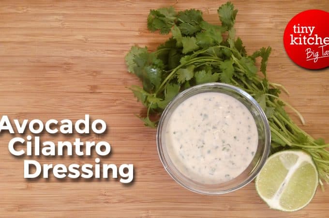 Avocado Cilantro Dressing on a bowl with lime