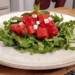 Arugula, watermelon, feta cheese salad on a plate