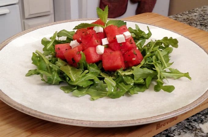 Arugula, watermelon, feta cheese salad on a plate