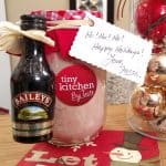 Homemade Hot Cocoa Mix and kahlua with Christmas decorations on table