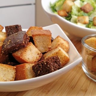 croutons in a bowl with caesar salad