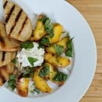 Grilled Summer Peach Salad // Tiny Kitchen Big Taste on white plate with burrata cheese and grilled bread