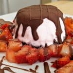 Mini Oreo Cookie Ice Cream Pie with Chocolate Shell Topping and Strawberries on a Plate
