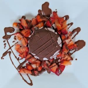 Mini Oreo Cookie Ice Cream Pie with Chocolate Shell Topping and Strawberries on a Plate
