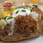 Loaded Baked Potato on a white plate