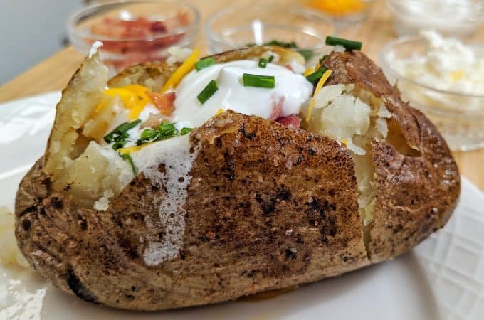 Loaded Baked Potato on a white plate