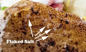 Close up of potato skin with flaked salt