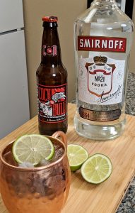 Moscow Mule, Smirnoff Vodka, Cock'n Bull Ginger Beer, Lime on Bamboo Cutting board